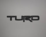 Toyota Turd Badge